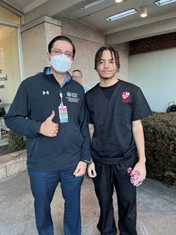 Top Notch Scholars student intern Kasdaniel Reyes, right, was inspired to become part of the program after speaking to Lawrence General’s Dr. Luis Quiel, who serves as hospitalist program director. Reyes hopes to become a surgeon one day.