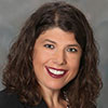 A close-up of a person smilingAI-generated content may be incorrect.